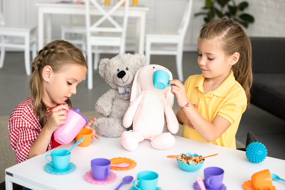Pretend play tea party with stuffed animals